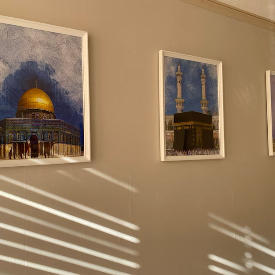 Customer photo: Dome of the Rock and Kaaba prints in white frames along a hallway
